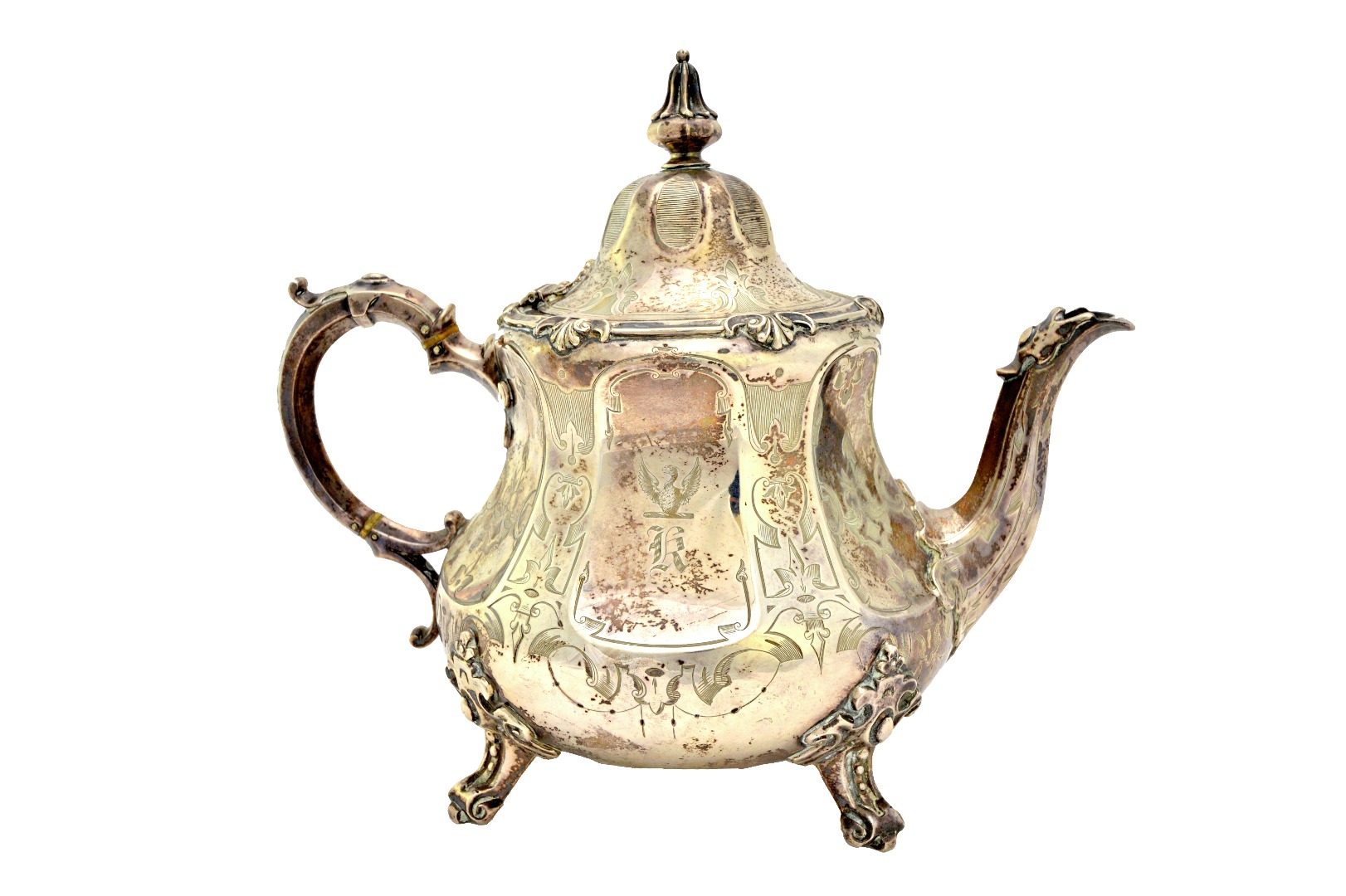 Appraisal: A Victorian silver teapot of compressed pear shaped form having