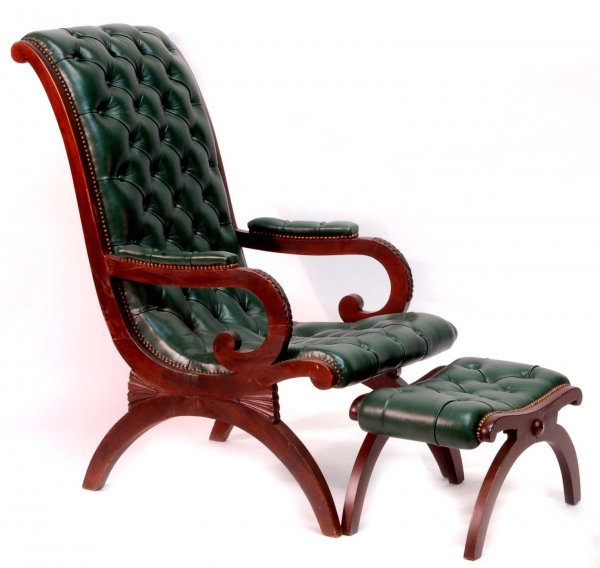 Appraisal: Chair and ottoman Carved frame Tufted green leather upholstery Fruitwood