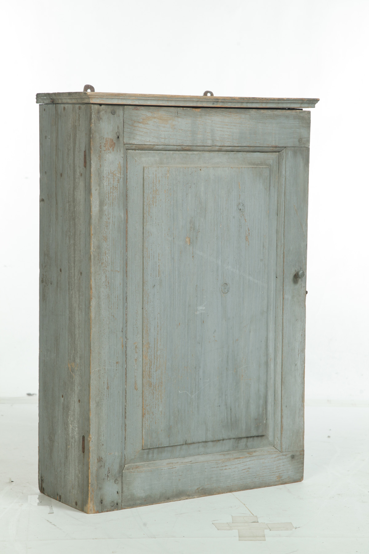 Appraisal: PRIMITIVE PAINTED BLIND-DOOR HANGING WALL CUPBOARD American nd half- th