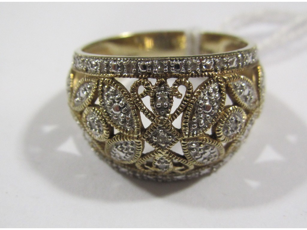 Appraisal: Nine carat bi colour gold diamond set openwork bomb ring