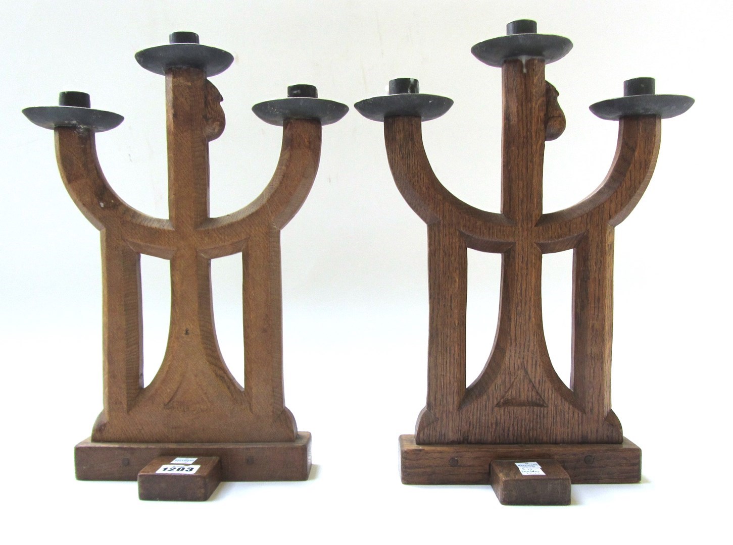 Appraisal: A pair of carved oak triple sconce candelabra by Robert