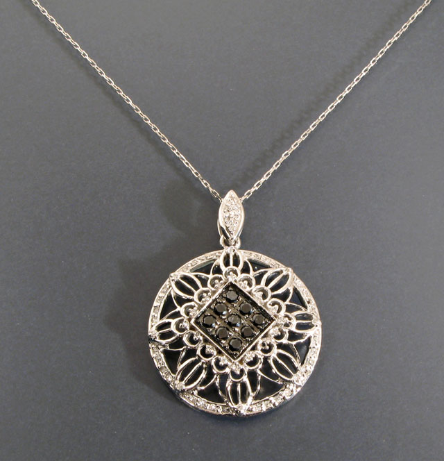 Appraisal: DIAMOND AND FOURTEEN KARAT WHITE GOLD PENDANT NECKLACE the round