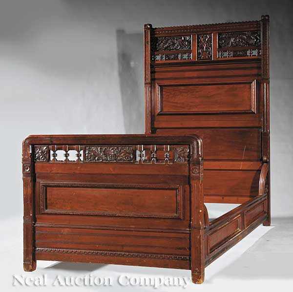 Appraisal: A Pair of American Aesthetic Carved and Incised Mahogany Beds