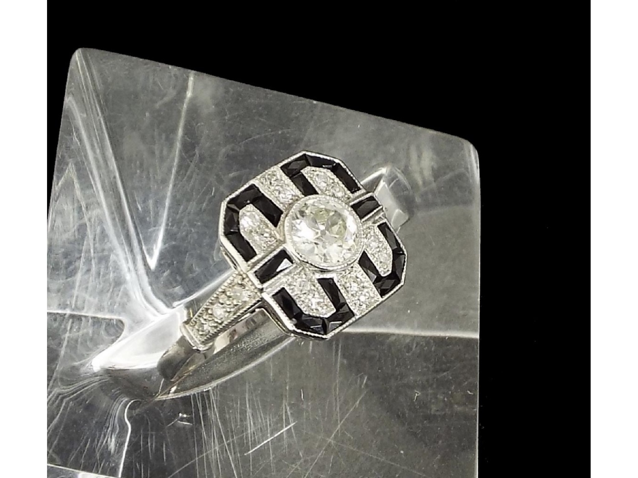 Appraisal: Art Deco style ct onyx and diamond square cluster ring