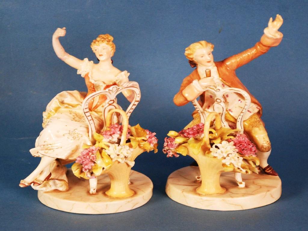 Appraisal: A PAIR OF GERMAN PLAVE PORCELAIN MODELS OF SEATED ELEGANT