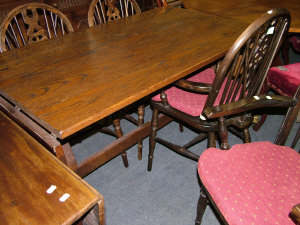 Appraisal: An oak drop leaf trestle dining table late th century