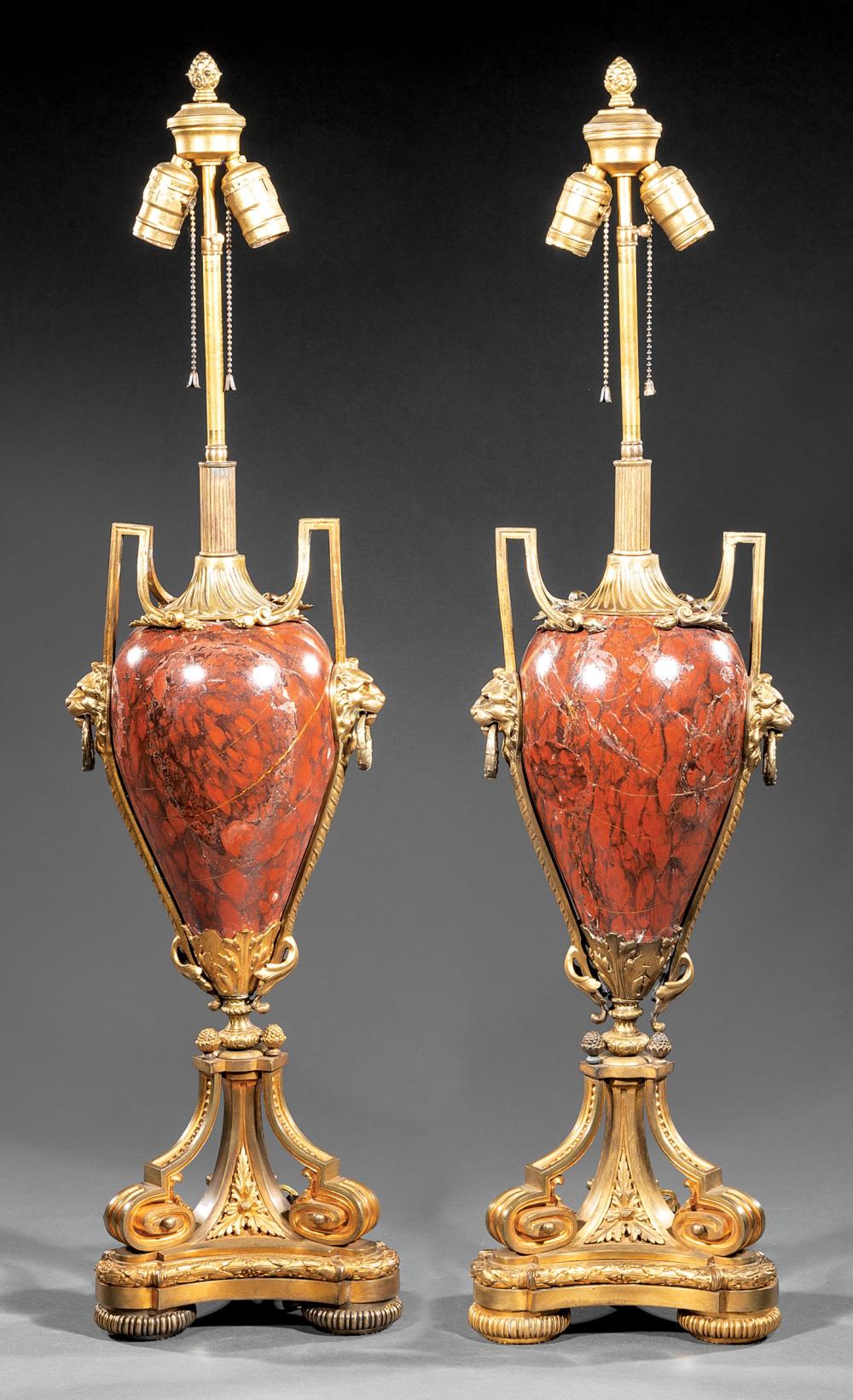 Appraisal: Pair of Empire-Style Bronze-Mounted Rouge Marble Lamps lion and ring