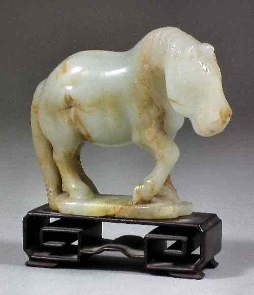 Appraisal: A Chinese pale celadon jade carving of a horse in