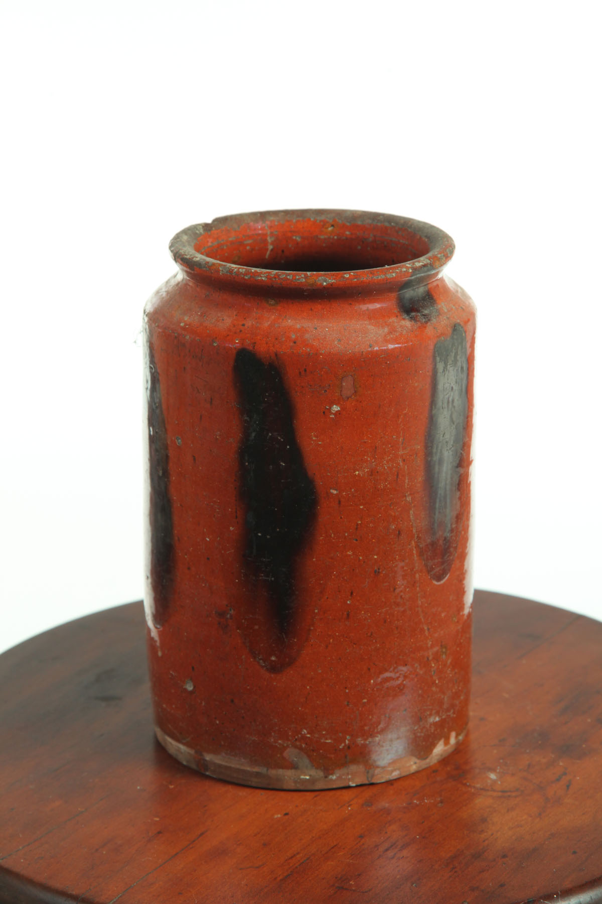 Appraisal: REDWARE CANNING JAR American mid th century Running manganese glaze