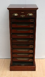 Appraisal: A mid th century mahogany roll-front filing cabinet cm wide