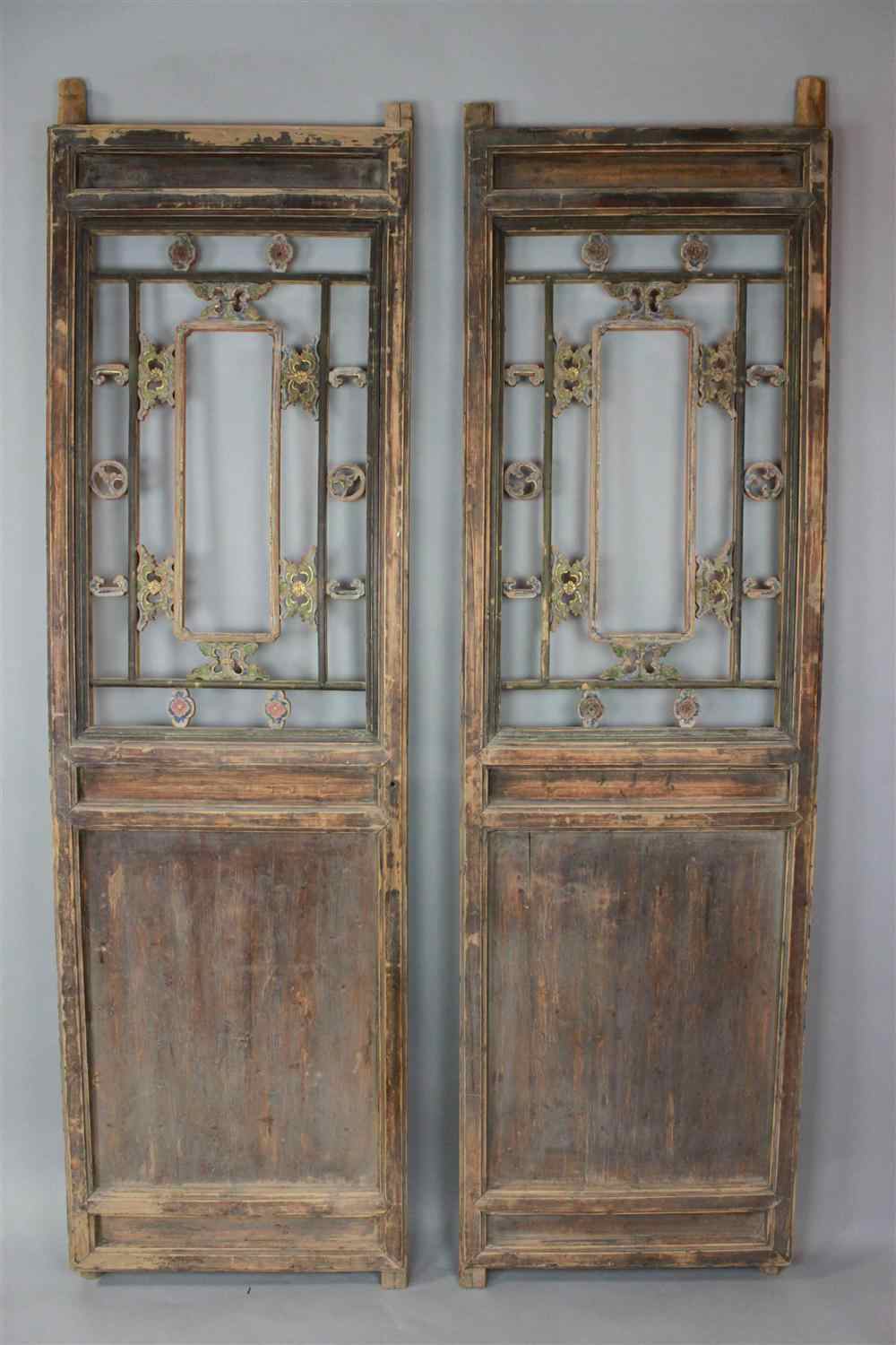 Appraisal: PAIR OF CHINESE CARVED SOFTWOOD DOORS both of slender rectangular