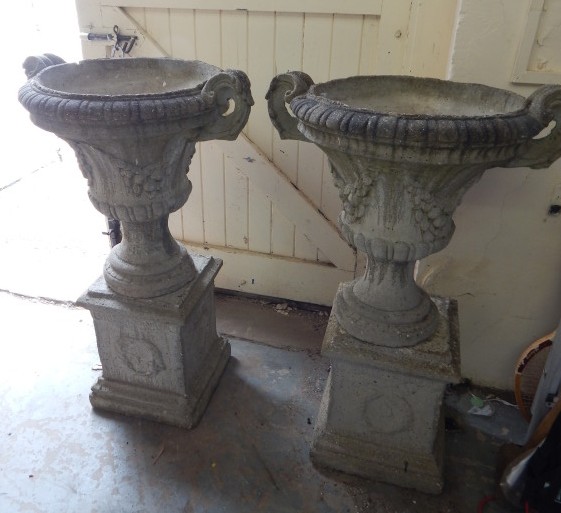 Appraisal: A pair of composition two handled campana shaped garden urns