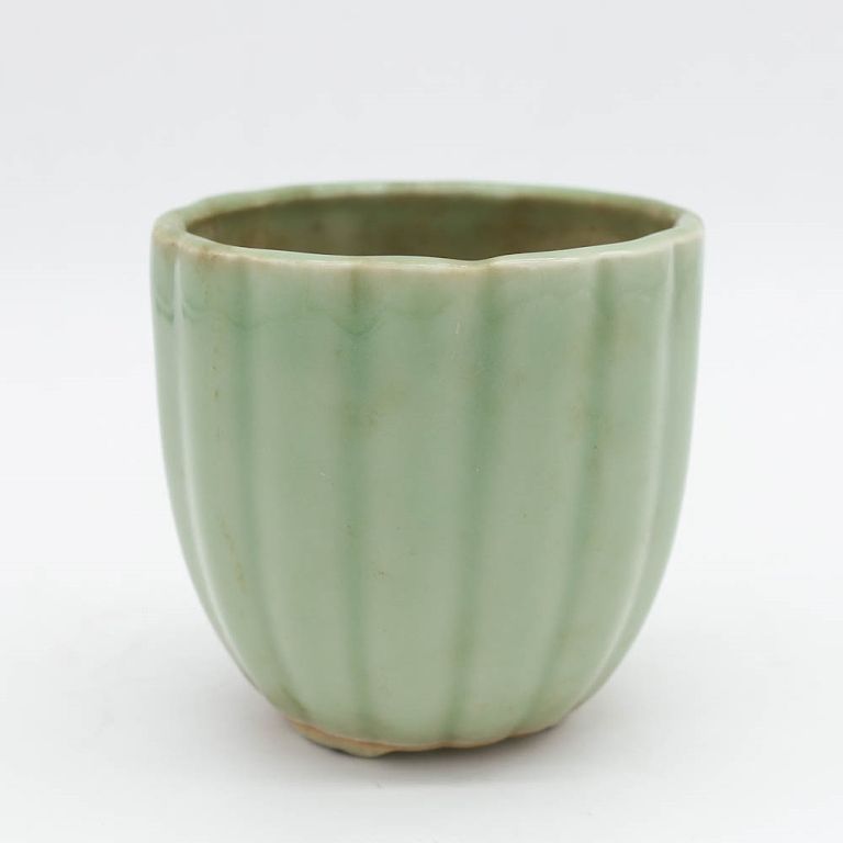 Appraisal: CELADON GLAZE LOBED PLANTER The body of slightly tapering form