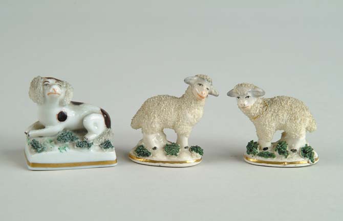 Appraisal: THREE MINIATURE STAFFORDSHIRE ANIMALS Lot includes a pair of standing