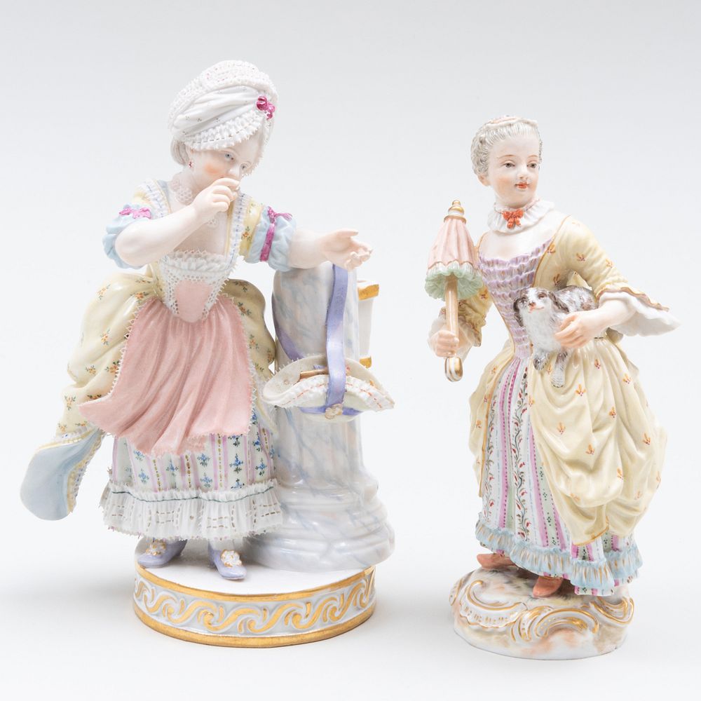 Appraisal: Two Meissen Figures of Maidens Each with blue crossed swords