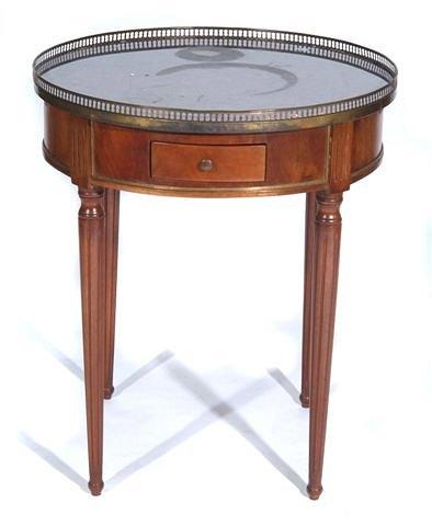 Appraisal: A FRENCH CIRCULAR TABLE with grey marble top and pierced