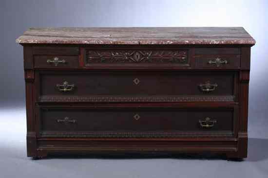 Appraisal: VICTORIAN CARVED MAHOGANY CHEST-OF-DRAWERS th century Marble top projects over