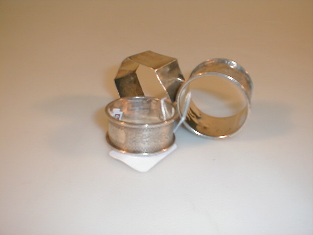 Appraisal: Three various silver napkin rings