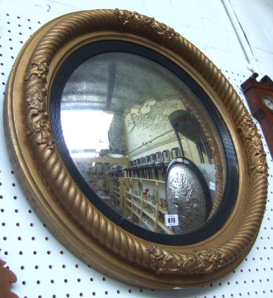 Appraisal: A th century gilt framed convex wall mirror the rope