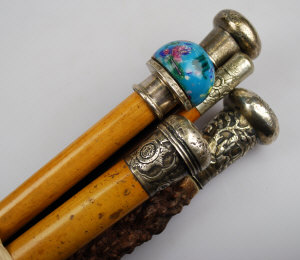 Appraisal: Five silver white-metal mounted walking canes one with millefiori glass