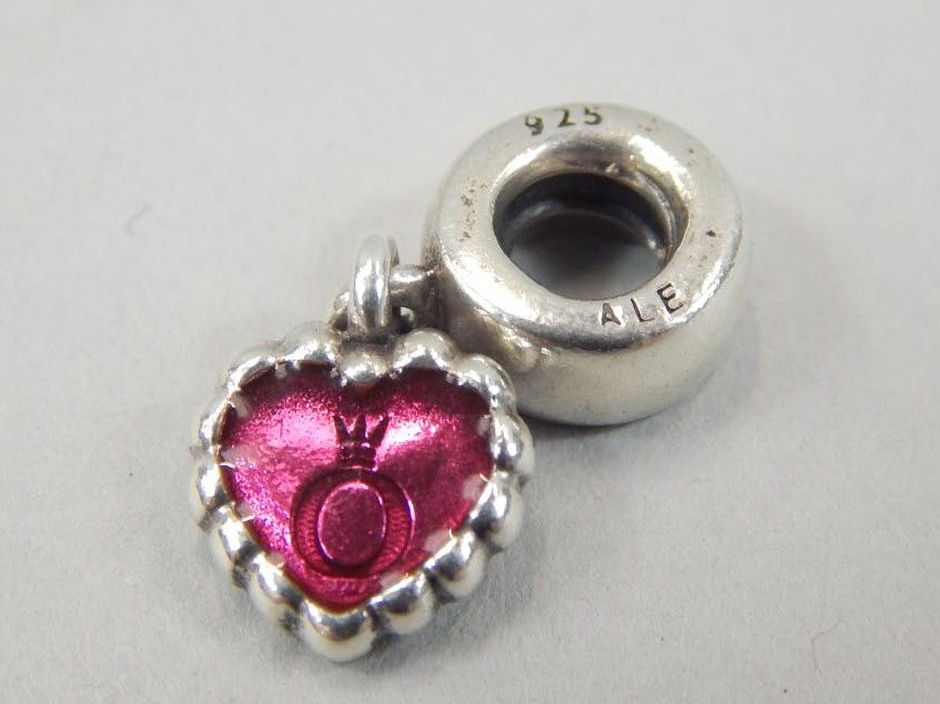 Appraisal: A Pandora pink heart charm the heart on dangle drop