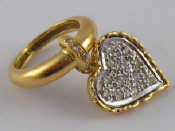 Appraisal: An carat gold ring with diamond set heart pendant heart