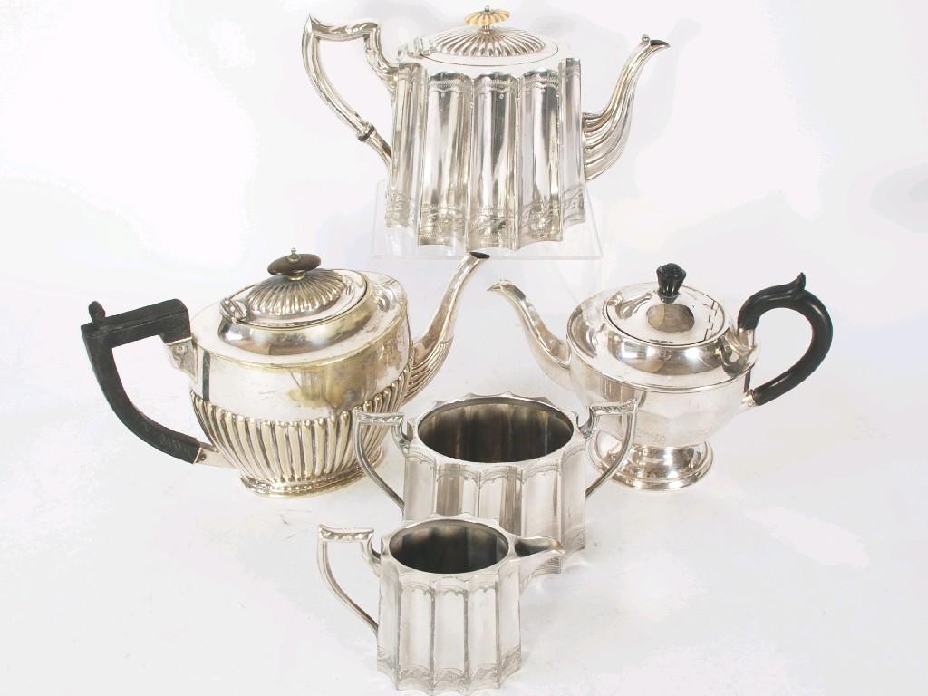 Appraisal: NINE EARLY TWENTIETH CENTURY ELECTROPLATED THREE AND FOUR PIECE TEA