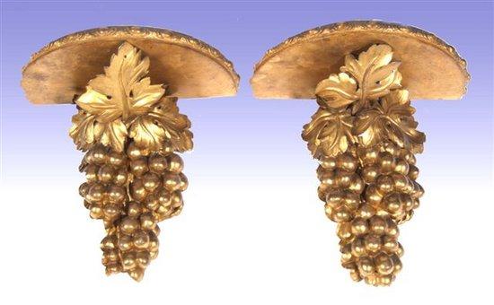 Appraisal: A pair of carved gilt wood wall brackets each in