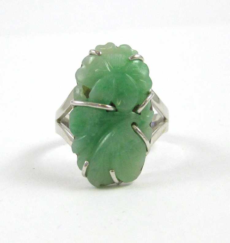 Appraisal: JADE AND EIGHTEEN KARAT WHITE GOLD RING with an oval