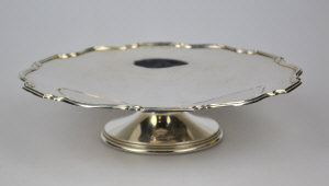 Appraisal: A silver comport with moulded rim and flared stem Barker