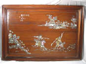 Appraisal: A Chinese hardwood wall plaque inlaid with engraved m o