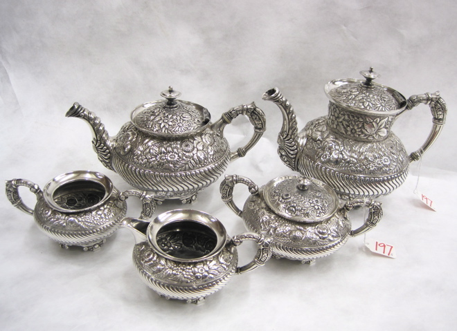 Appraisal: FIVE PIECE SILVER PLATE COFFEE TEA SERVICE repousse decoration Includes