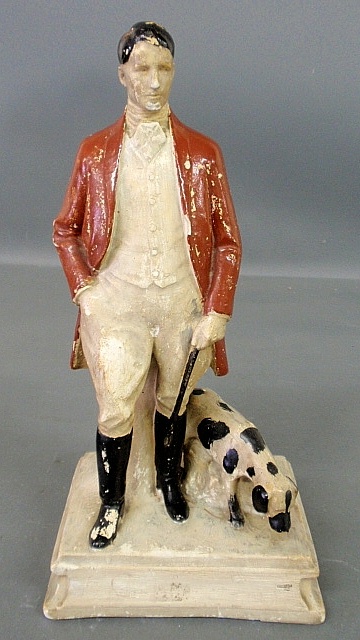 Appraisal: - Chalkware standing foxhunter and hound marked Trade Mark Reg