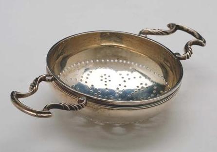 Appraisal: EARLY GEORGE III SILVER TWO-HANDLED ORANGE AND LEMON STRAINER LONDON