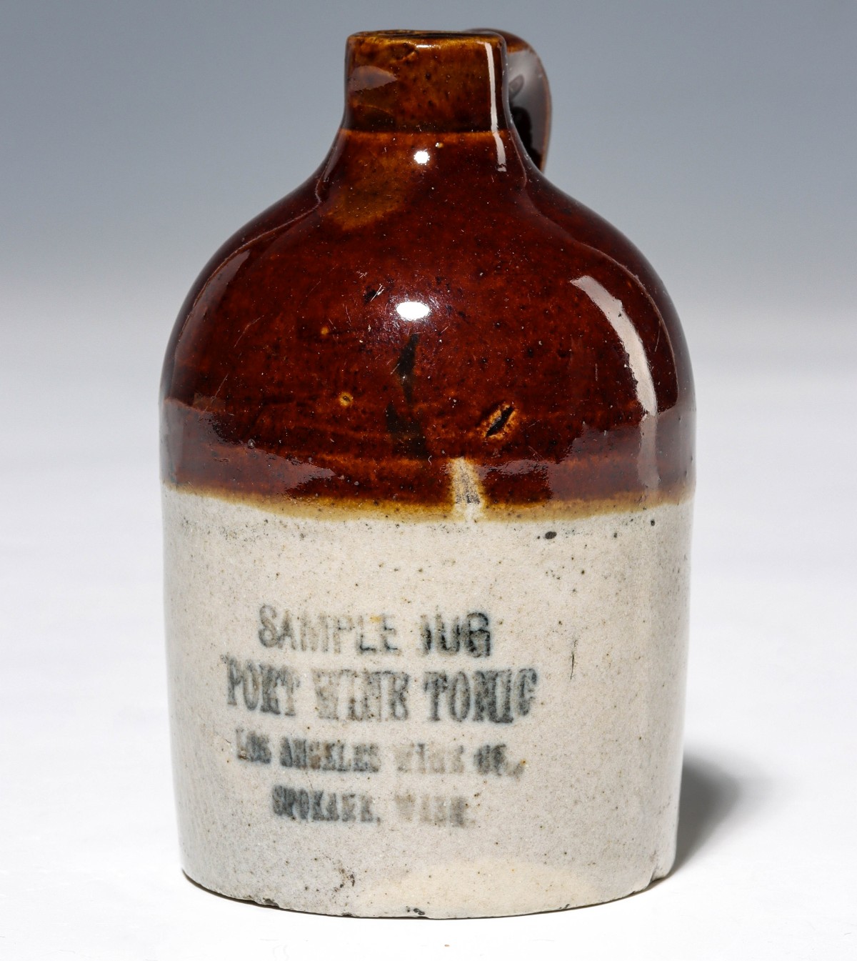 Appraisal: SPOKANE AND LOS ANGELES 'PORT WINE TONIC' MINI JUG