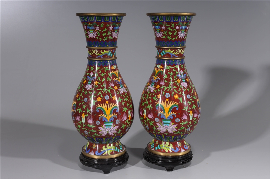 Appraisal: Pair Chinese red ground cloisonne enamel vases each with wood