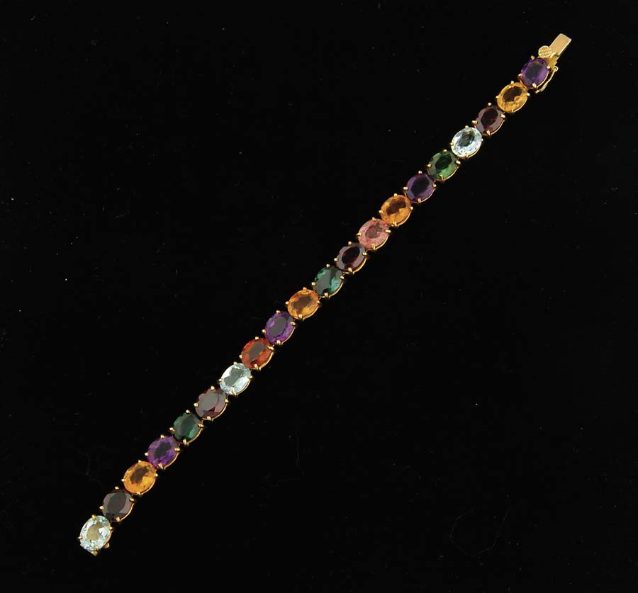 Appraisal: K YELLOW GOLD MULTI-GEM TENNIS BRACELET Clasp marked Multi-colored stones