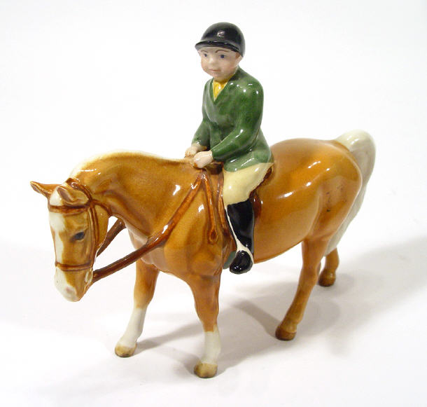 Appraisal: Hand painted Beswick girl on tan pony printed factory mark