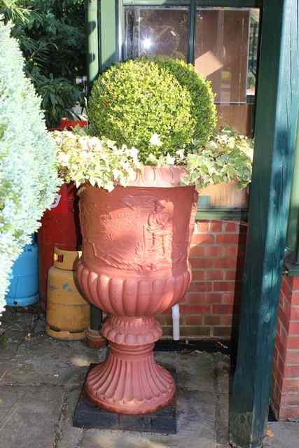 Appraisal: A PAIR OF LARGE CAST IRON URNS of classical form