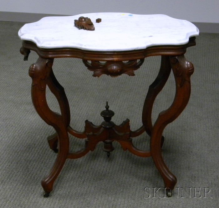 Appraisal: Victorian White Marble Turtle-top Carved Walnut Occasional Table