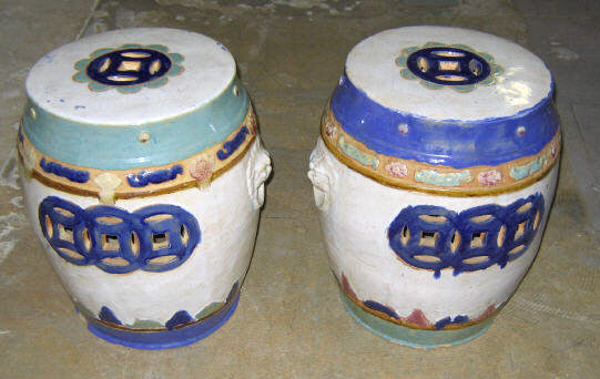 Appraisal: PAIR OF ASIAN EARTHENWARE GARDEN SEATS Cylindrical with geometric pierced