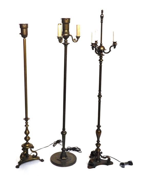 Appraisal: Three floor lamps with metal bases three white fabric shades