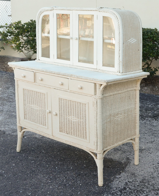 Appraisal: UNUSUAL WHITE WICKER SIDEBOARD Top with arched sides glass doors