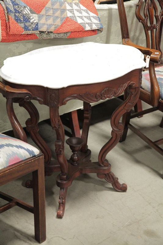 Appraisal: VICTORIAN PARLOR TABLE Marble turtle top on a walnut shell