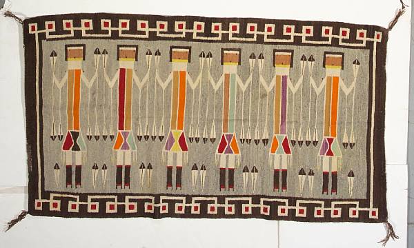 Appraisal: A Navajo Yei rug Depicting six Yei figures holding prayer