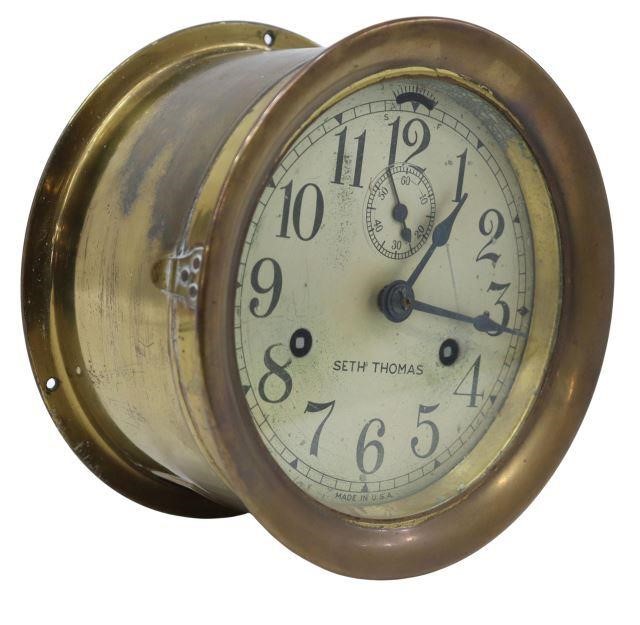 Appraisal: Seth Thomas ships bell clock in brass housing hinged front