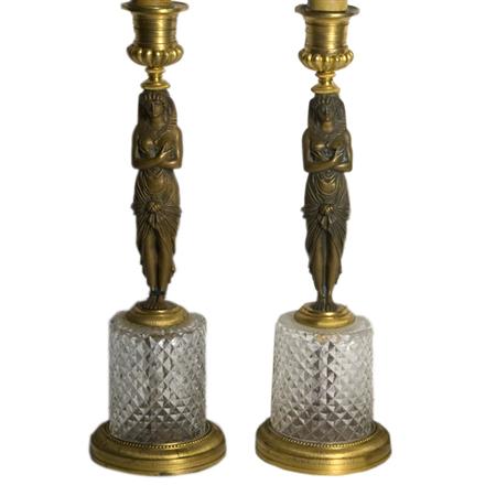 Appraisal: Pair of Egyptian Revival Style Glass and Gilt-Metal Candlesticks Estimate