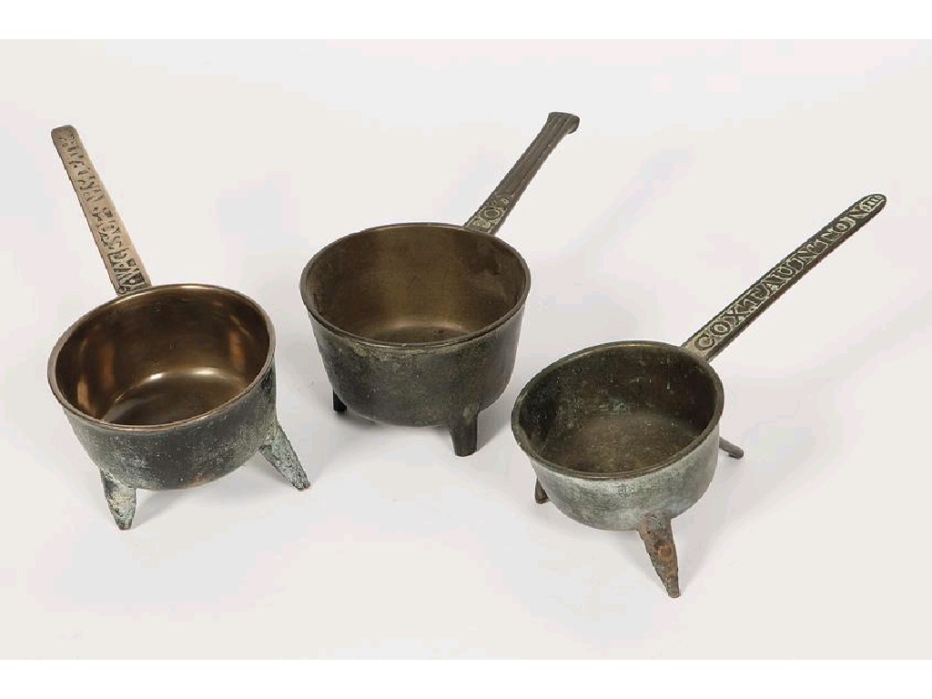 Appraisal: THREE BRONZE SKILLETS each with cast names to the handles