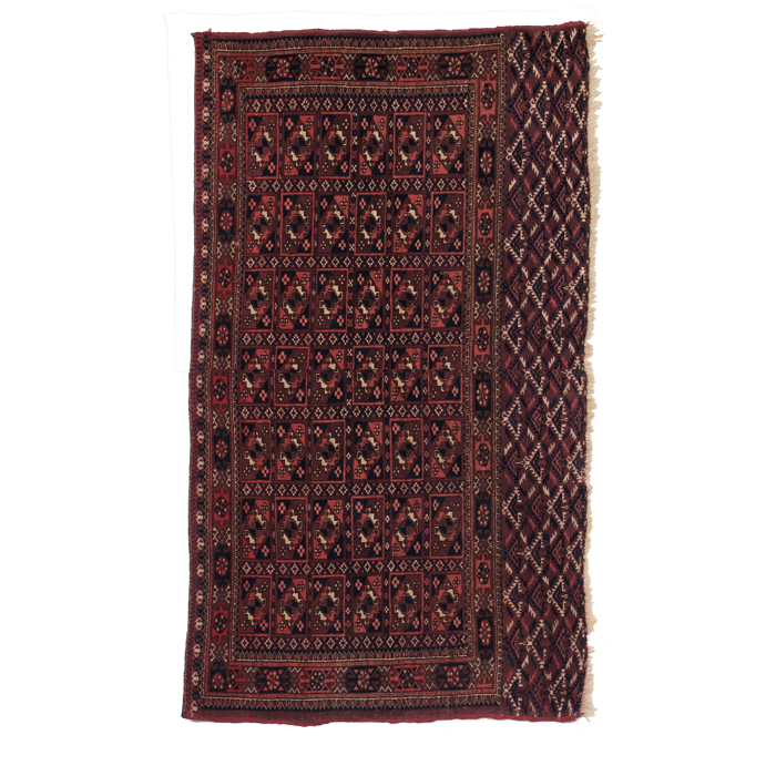 Appraisal: Turkoman rug c stylized floral design on a red field