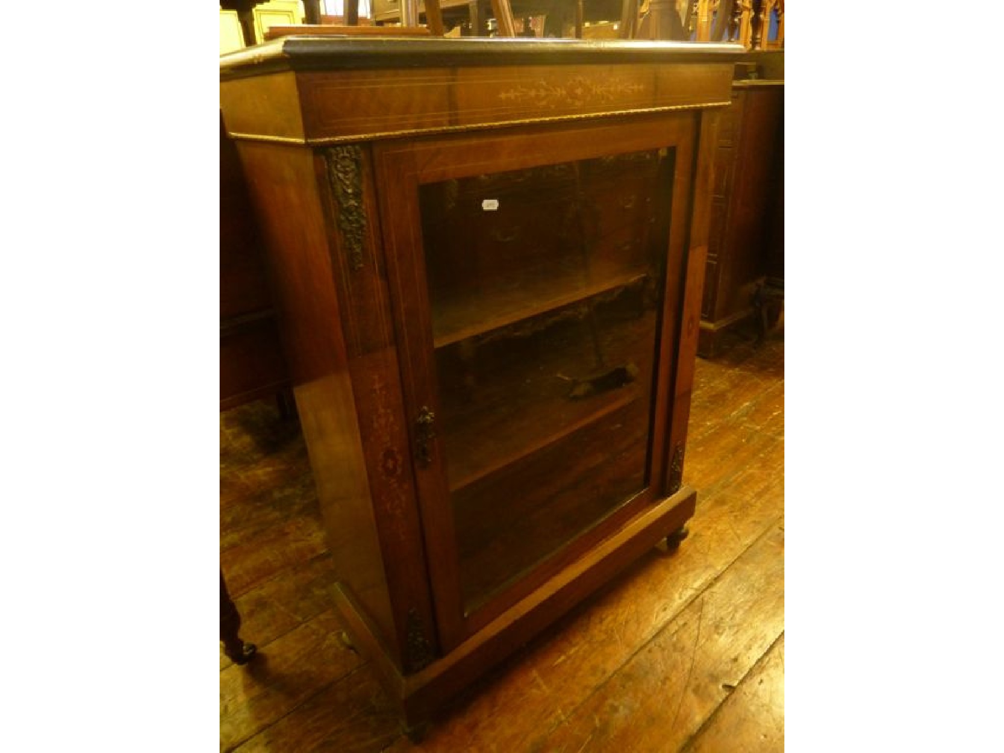 Appraisal: A Victorian walnut pier cabinet with inlaid detail enclosed by